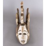 An Igbo Maiden Spirit mask, 56 cm high