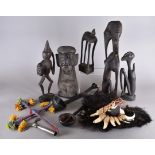 A group of African figure sand other items, including a Yoruba priest's staff top, group of