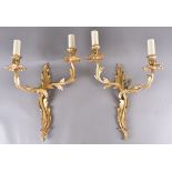 A pair of gilt bronze wall sconces, of naturalistic leaf design, two branch, wired for electric,