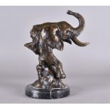 A contemporary bronze study of a bull elephant head on black marble plinth base, 38 cm high