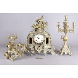 A modern brass clock garniture, the ornate mantle clock surmounted with a horse and rider, two