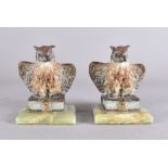 A pair of early 20th century Viennese cold painted bronze owls, both modelled with wings slightly