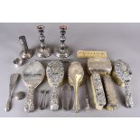 A pair of modern silver filled candlesticks, a collection of silver backed dressing table items