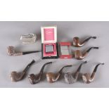 A collection of M J Elliott carved briar pipes, the smooth bowls with vulcanite hand cut stems all