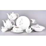 A Royal Doulton Pillar Rose dinner and tea service comprising eight dinner plates, six lunch plates,