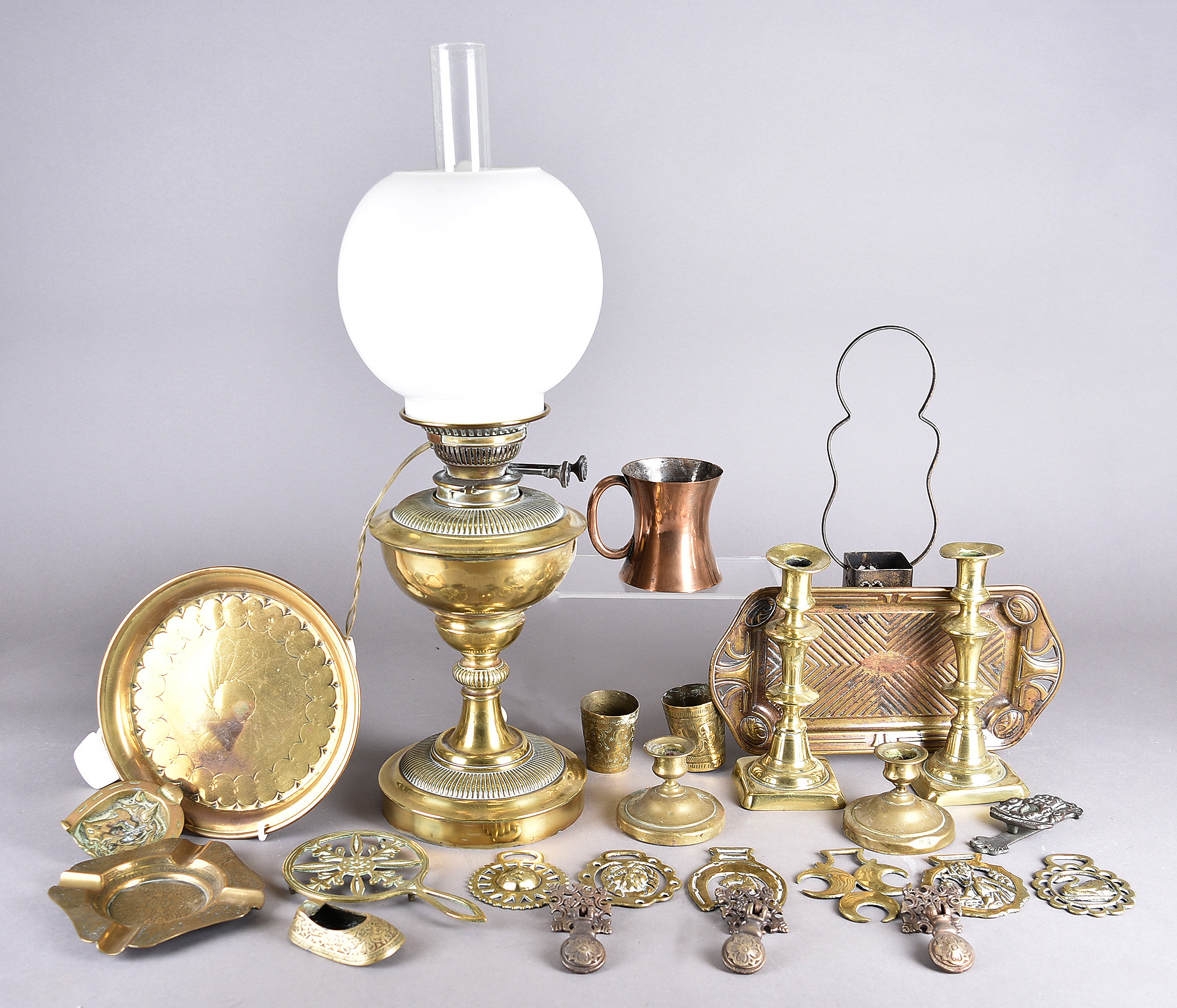 A collection of metalware, including a brass oil lamp, an Art Nouveau tray and other items etc