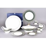 A Royal Doulton Vanborough pattern dinner service setting for eight comprising eight dinner