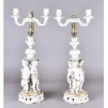 A pair of Volkstedt porcelain table lamps, converted from candlesticks, surmounted with three