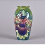 A modern Moorcroft ovoid vase with tubelined decoration finches and fruit, 18.5 cm high