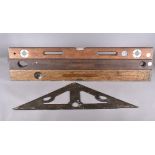 A Victorian cast iron mason's spirit level, of triangular shape, with cut out design, with