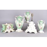 A 19th century French porcelain garniture, ovoid vases with central floral sprays, green and white