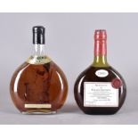 Two bottles of Armagnac, one dated 1969, 50 cl the other with boxwood figure of huntsman and begging