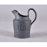 A 19th century black basalt jug, with classical frieze decoration, 11 cm high