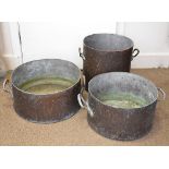 Three large copper twin handled preserve pans, largest 44 cm diameter, 40 cm diameter and 35 cm