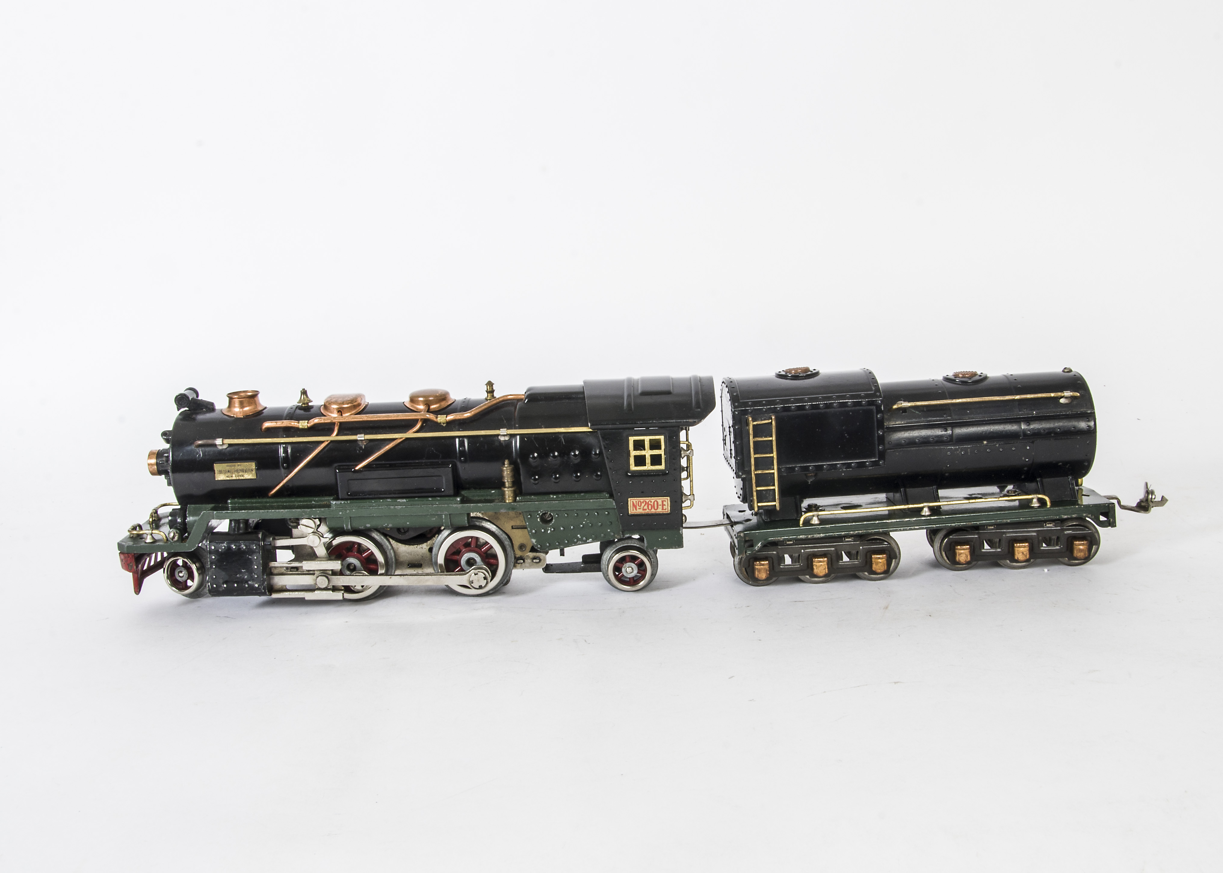 A Vintage Lionel O Gauge 3-rail 260E Locomotive and 260T Tender, the Locomotive in black with