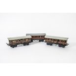 Three Fine Bing O Gauge LMS 'Shortie' Bogie Coaches, comprising two 1st/3rd composite coaches, (