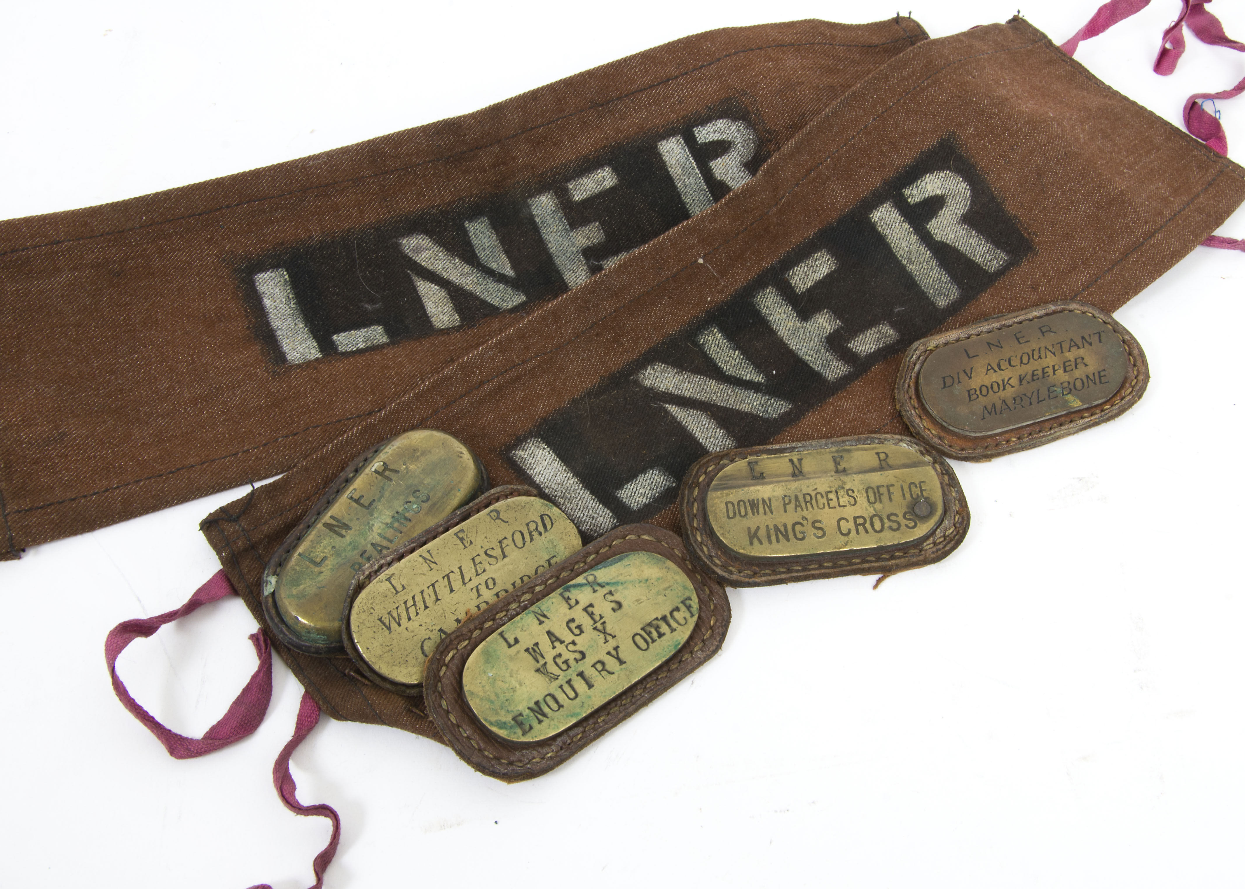LNER Brass Satchel Name Plates and Arm Bands, two brown canvas arm bands printed LNER together