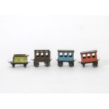 Early Penny Toys unmarked Tender and three Coaches, Tender in green with blue, orange and maroon