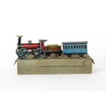 Large Hess 'Penny Toy ' Train and Coach, red and black clockwork engine No 575 with four-spoke
