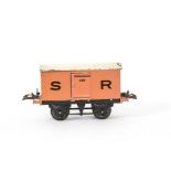 A Hornby O Gauge SR Refrigerator Van, on black 'T3' base, in salmon pink with dark brown 'SR'