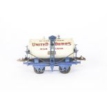 A Hornby O Gauge 'United Dairies' Milk Tank Wagon, with blue 'T3' base, overall G-VG, slightly