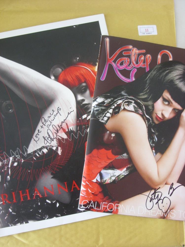 Pop Music, a pair of autographed tour programmes signed by Rihanna & Katy Perry