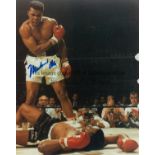MUHAMMAD ALI Ten inch x eight inch colour photograph of Ali in action and signed across his