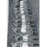 MANCHESTER UTD 1958 B/W 12” x 8” photo, showing Manchester United players lining up shoulder to