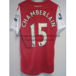 ALEX OXLADE-CHAMBERLAIN ARSENAL MATCH WORN SHIRT A red shirt with white short sleeves worn in the