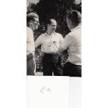 STIRLING MOSS AUTOGRAPHS A signed 7" X 5" b/w photograph of Moss before the Le Mans Grand Prix in