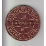 MANCHESTER UNITED 1920s Gilt inscribed Manchester United Steward badge with pin on reverse side.