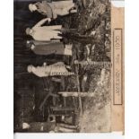 NUNHEAD Two large press photographs showing firemen and others sifting through the charred remains