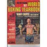 SIR HENRY COOPER AUTOGRAPHS Two Sir Henry Cooper autographs: On the front cover of 1971 World Boxing