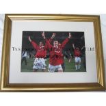 TEDDY SHERRINGHAM & OLE GUNNAR SOLSKJAER AUTOGRAPHS A framed and glazed 18" X 14" colour