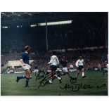 BOBBY SMITH AND JIMMY GREAVES AUTOGRAPHS A 10" X 8" colour signed photograph of England in action