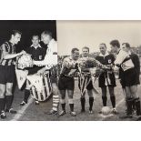 FRENCH FOOTBALL Two 7" x 10" press photographs showing the captains of Le Havre and Atlanta