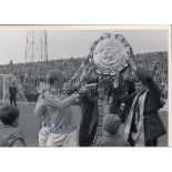 COLIN BELL AUTOGRAPHS An 11" X 8" black & white photograph of Colin Bell with fans holding the