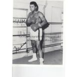 MUHAMMAD ALI SIGNED PHOTOGRAPH A signed 10" X 8" black & white picture of Ali in boxer's pose in