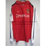 LAUREN / ARSENAL MATCH WORN SHIRT Red shirt with white long sleeves worn in the Arsenal away