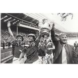 MANCHESTER UNITED AUTOGRAPHS An 8" X 6" black & white photograph of United on their lap of honour