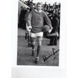 DENIS LAW AUTOGRAPH A 10" X 8" black & white signed photograph of Law holding a ball under his