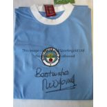 NEIL YOUNG - MANCHESTER CITY A replica blue Manchester City shirt as worn in the early 1970s, signed