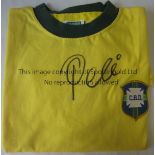 PELE AUTOGRAPH A yellow short sleeve Brazil shirt signed by Pele on the front with a Certificate
