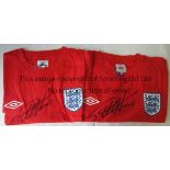 GEOFF HURST AUTOGRAPHS Two short sleeve red T-shirts with the three Lions England badge, signed on