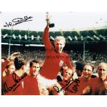 WORLD CUP 1966 AUTOGRAPHS Four signed 10" X 8" photographs: Colour of Bobby Moore holding the trophy