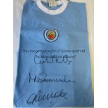 MANCHESTER CITY A replica blue Manchester City shirt as worn in the early 1970s, signed by Colin