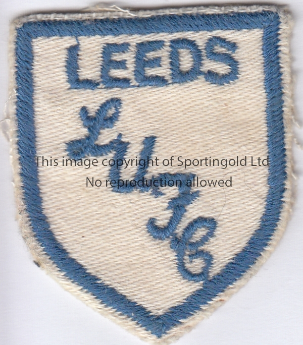 LEEDS UNITED Small cloth badge , blue and white , with "Leeds" in blue below a blue border on