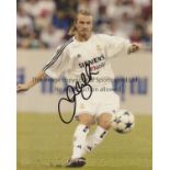DAVID BECKHAM AUTOGRAPH A 10" X 8" signed colour action photograph of Beckham playing for Real