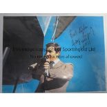 GEORGE LAZENBY AUTOGRAPH A large signed 16" X 12" colour photograph of Lazenby as James Bond holding