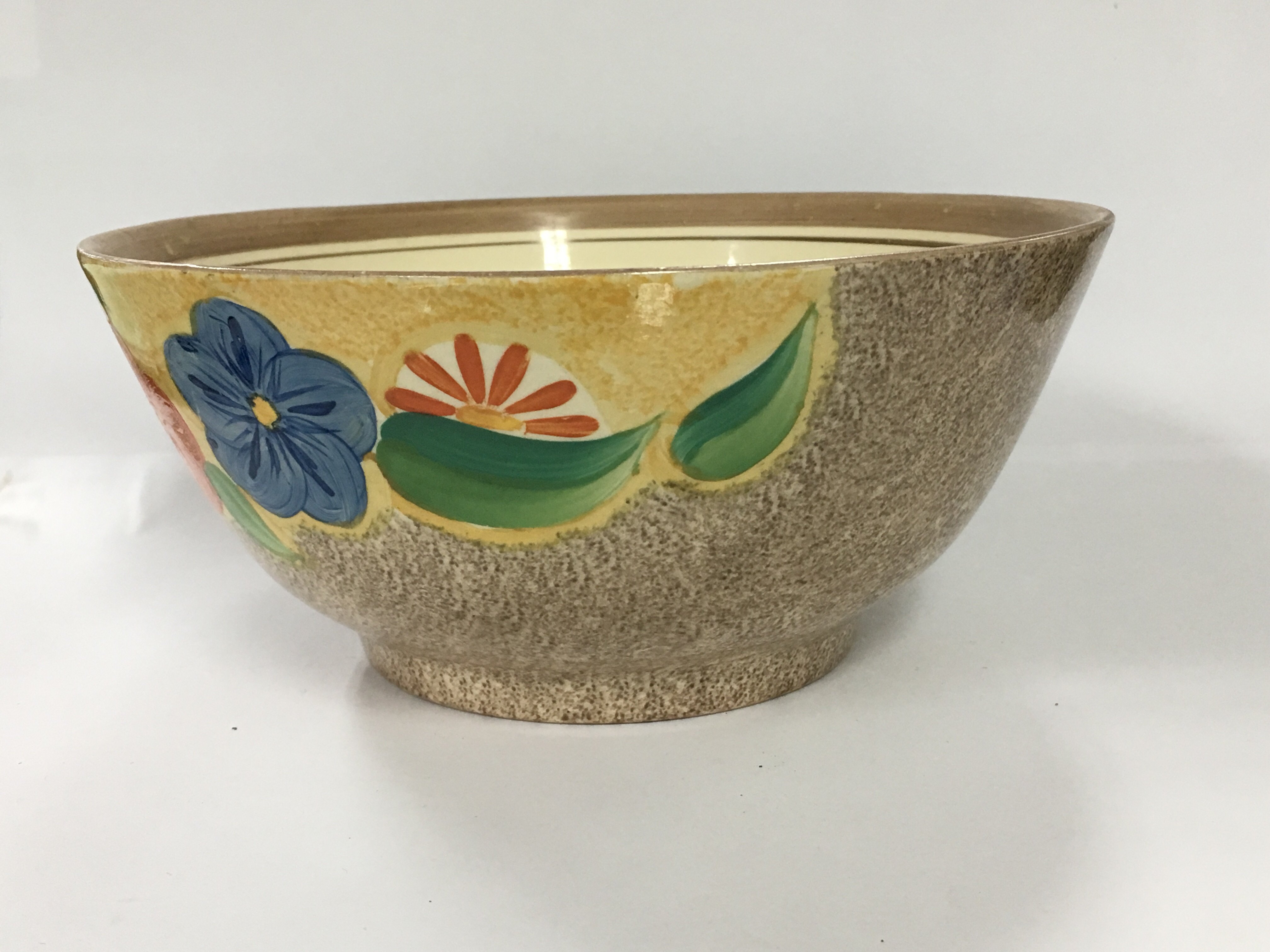 A Clarice Cliff floral pattern bowl 20cm diameter